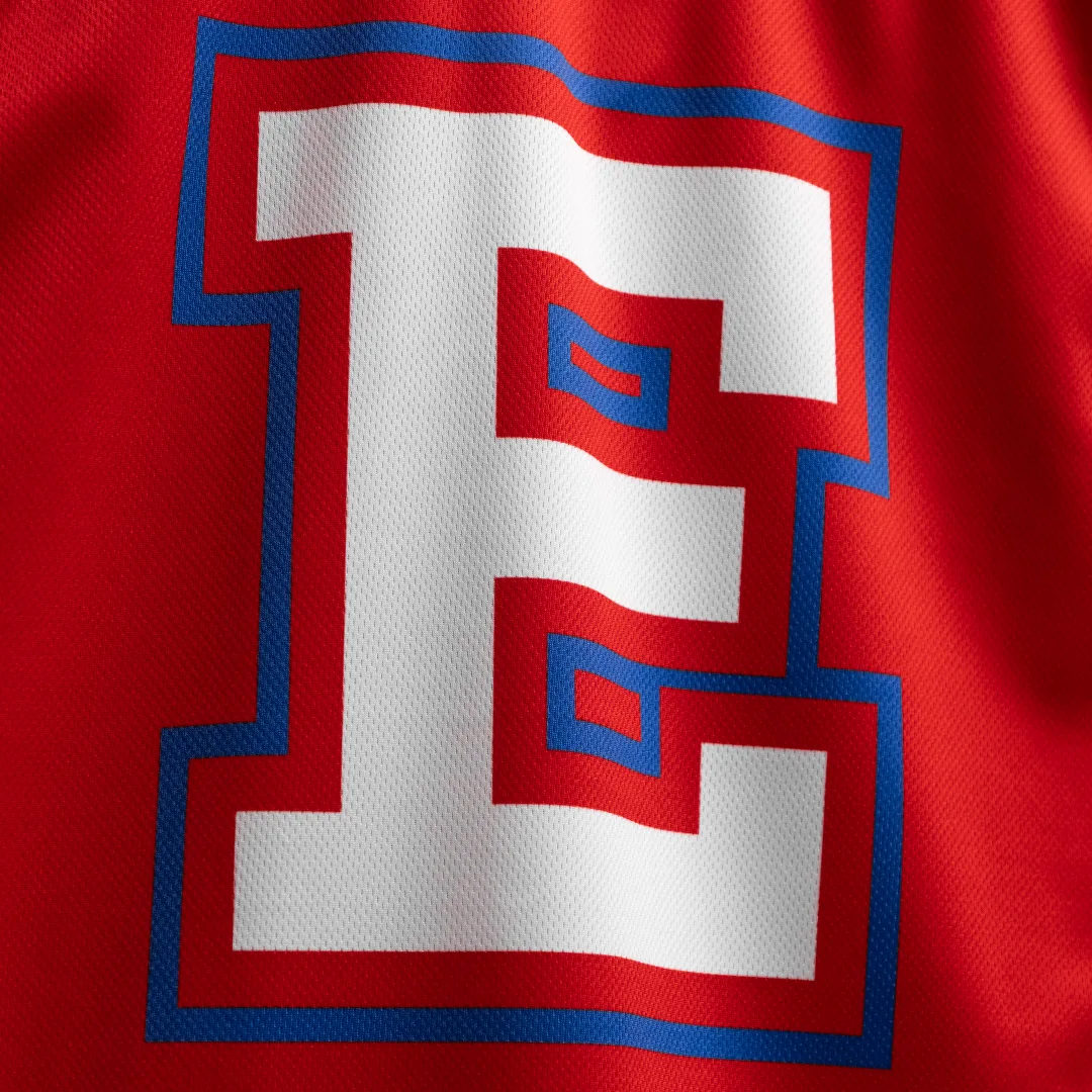 Close-up of sublimated logo detail on custom hockey jersey